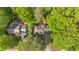 Aerial view of the home showcasing the surrounding lush greenery and landscaping at 4181 Singing Post Ne Ln, Roswell, GA 30075