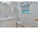 Bathroom with a white vanity, toilet, and framed mirror at 4181 Singing Post Ne Ln, Roswell, GA 30075