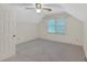 Bedroom featuring neutral walls and carpet, along with a ceiling fan and a window at 4181 Singing Post Ne Ln, Roswell, GA 30075
