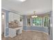 Charming breakfast nook features a built-in desk, ample natural light, and neutral paint at 4181 Singing Post Ne Ln, Roswell, GA 30075