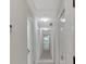 Hallway with white doors and neutral paint at 4181 Singing Post Ne Ln, Roswell, GA 30075