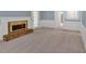 Light-filled living room showcases a brick fireplace, a door to the outside and access to other rooms at 4181 Singing Post Ne Ln, Roswell, GA 30075