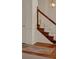Picture of stairs with wood trim and neutral colored carpet at 4181 Singing Post Ne Ln, Roswell, GA 30075
