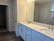 Bathroom with double sinks, white cabinets, and quartz countertop at 93 Riverwood Dr, Dallas, GA 30157