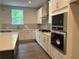 Well-equipped kitchen boasts stainless appliances, ample cabinetry, and stone countertops at 93 Riverwood Dr, Dallas, GA 30157