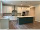 Bright, open kitchen featuring a large island, stainless steel appliances, and modern pendant lighting at 93 Riverwood Dr, Dallas, GA 30157