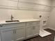 Laundry room with built in cabinets and sink at 93 Riverwood Dr, Dallas, GA 30157
