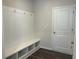 Bright mudroom featuring a coat rack, built-in bench, and convenient storage cubbies for organization at 93 Riverwood Dr, Dallas, GA 30157