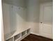 Organized mudroom with built-in bench seating, storage cubbies, and coat hooks for convenience at 93 Riverwood Dr, Dallas, GA 30157
