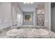Bathroom features granite countertops, dual sinks, and large mirror at 119 Sourwood Lane, Temple, GA 30179