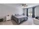 Bedroom featuring a ceiling fan, window, and a large bed at 119 Sourwood Lane, Temple, GA 30179