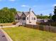 Charming two-story home with a well-manicured lawn and fenced backyard, perfect for outdoor enjoyment at 119 Sourwood Lane, Temple, GA 30179
