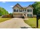 Inviting two-story home with a front yard and attached garage, perfect for comfortable living at 119 Sourwood Lane, Temple, GA 30179