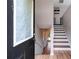 Bright foyer with wooden floor and stairway leading to the upper level at 119 Sourwood Lane, Temple, GA 30179