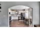 Open kitchen with stainless appliances, dining area, and white cabinets at 119 Sourwood Lane, Temple, GA 30179