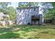 Spacious backyard features a small deck, a well-maintained lawn, and a privacy fence, perfect for outdoor activities at 1390 Almont Sw Dr, Atlanta, GA 30310