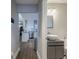 Bathroom featuring white vanity sink and white kitchen with stainless steel appliances in the background at 1390 Almont Sw Dr, Atlanta, GA 30310