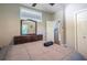 Comfortable bedroom featuring a ceiling fan, a dresser and a window with natural light at 1390 Almont Sw Dr, Atlanta, GA 30310