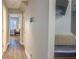 Hallway featuring wood floors and modern lighting fixture at 1390 Almont Sw Dr, Atlanta, GA 30310