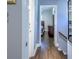 Hallway with wood flooring leading to a bedroom, offering a glimpse of the living space at 1390 Almont Sw Dr, Atlanta, GA 30310