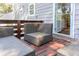 Outdoor patio area with wicker chairs and wood plank flooring at 1390 Almont Sw Dr, Atlanta, GA 30310