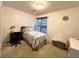Cozy bedroom with natural light from the window and decorative accents at 350 Rams Way, Tucker, GA 30084