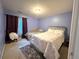 Bedroom with large window, plush carpet, and ample space for a cozy and private retreat at 350 Rams Way, Tucker, GA 30084