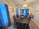 Elegant dining room featuring a large wooden table, seating for eight, and stylish decor at 350 Rams Way, Tucker, GA 30084