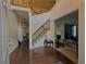 Bright foyer with hardwood floors, a staircase, and views into adjoining living spaces at 350 Rams Way, Tucker, GA 30084