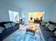 Cozy living room with plush sofas, decorative rug, and views of the dining area at 350 Rams Way, Tucker, GA 30084
