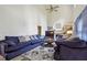 Spacious living room with high ceilings, fireplace, plush seating, and a ceiling fan for added comfort at 350 Rams Way, Tucker, GA 30084