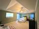 Comfortable main bedroom with tray ceiling, ceiling fan, and ample natural light from the large window at 350 Rams Way, Tucker, GA 30084