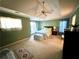 Comfortable main bedroom with a tray ceiling, ceiling fan, and ample natural light from windows at 350 Rams Way, Tucker, GA 30084