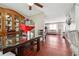 Open-concept dining area flows into living room with hardwood floors, modern furnishings, and neutral decor at 5022 Audubon Pl, Norcross, GA 30093