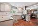 Updated kitchen with modern cabinets, stainless steel appliances, granite countertops, and a subway tile backsplash at 5022 Audubon Pl, Norcross, GA 30093