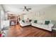 Open-concept living room featuring hardwood floors and seamless access to the adjacent kitchen at 5022 Audubon Pl, Norcross, GA 30093