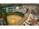 Aerial view of tennis courts and baseball field within the community, ideal for active residents at 6213 Arnall Nw Ct, Acworth, GA 30101