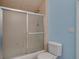 Bathroom featuring a tub and shower combo with a frosted sliding door at 6213 Arnall Nw Ct, Acworth, GA 30101