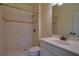 Bathroom featuring a tiled shower, vanity, and large mirror for a refreshing and functional space at 6213 Arnall Nw Ct, Acworth, GA 30101