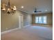 Large bedroom featuring a ceiling fan, neutral walls, and carpet at 6213 Arnall Nw Ct, Acworth, GA 30101