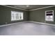 Empty bedroom with two windows allowing for natural light at 6213 Arnall Nw Ct, Acworth, GA 30101