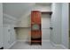 Walk-in closet with custom wooden storage and closet organizer at 6213 Arnall Nw Ct, Acworth, GA 30101