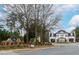 Elegant community entrance with stone signage and manicured landscaping, creating a welcoming atmosphere at 6213 Arnall Nw Ct, Acworth, GA 30101