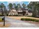 Charming two-story home with a stone and siding exterior, a well-manicured lawn and mature landscaping at 6213 Arnall Nw Ct, Acworth, GA 30101