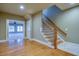Elegant foyer with hardwood floors, a staircase with wood railings, and a view to the living room at 6213 Arnall Nw Ct, Acworth, GA 30101