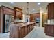 Gourmet kitchen featuring stainless steel appliances, double ovens, and a large island with bar seating at 6213 Arnall Nw Ct, Acworth, GA 30101