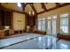 Bright living room with custom built-ins and large window perfect for lounging and entertaining guests at 6213 Arnall Nw Ct, Acworth, GA 30101