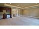 Spacious living room with a wet bar, modern cabinetry, and neutral carpet at 6213 Arnall Nw Ct, Acworth, GA 30101