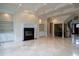 Spacious living room with coffered ceiling, fireplace, built-in shelves, and marble floors, perfect for entertaining at 6213 Arnall Nw Ct, Acworth, GA 30101