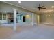 Open living area with decorative columns, built-in bookshelves, and stone fireplace at 6213 Arnall Nw Ct, Acworth, GA 30101